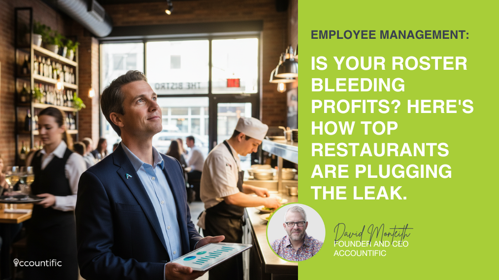 A confident restaurant owner looks up from a tablet displaying charts, overseeing a bustling bistro with a chef and server in the background.